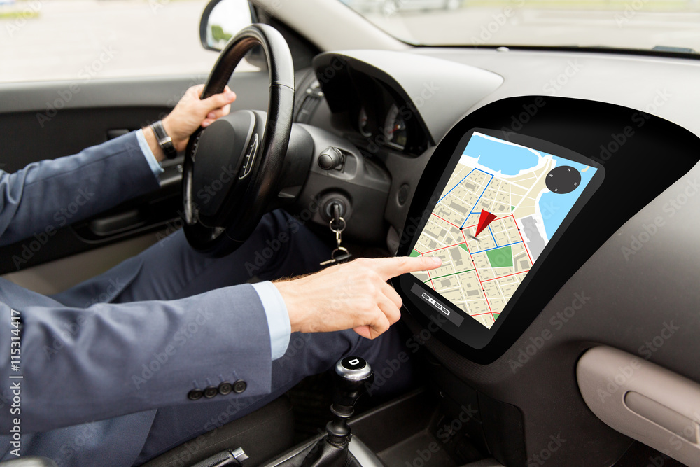close up of man driving car with gps navigator map