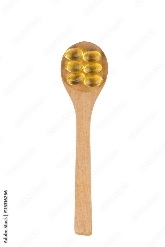 Omega 3 pills on a spoon. Omega 3 pills on a spoon.