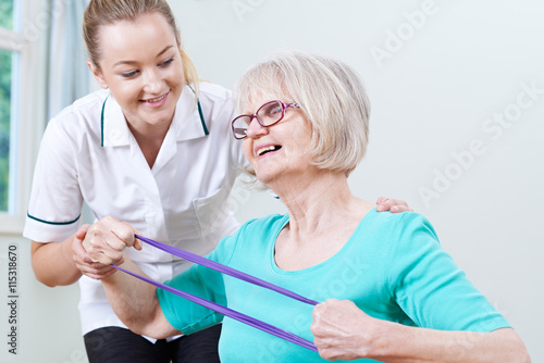 Senior Female Working With Physiotherapist