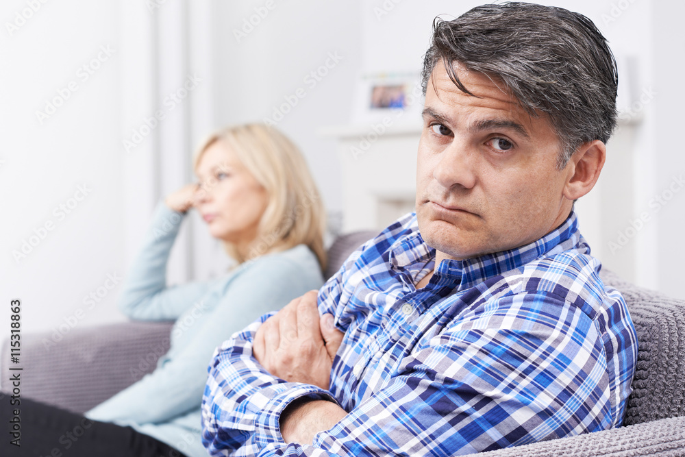 Couple With Relationship Difficulties Sitting On Sofa Couple With Relationship Difficulties Sitting On Sofa