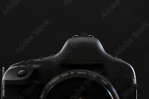 Professional modern DSLR camera low key stock photo/image