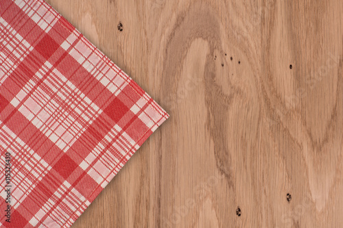 the checkered tablecloth on wooden table