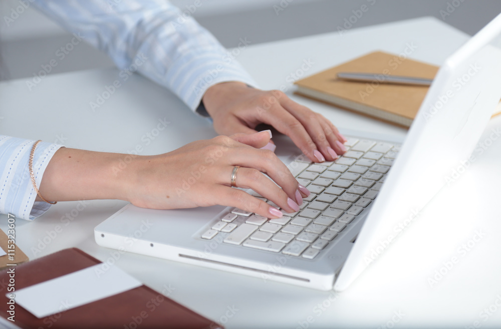 Young pretty business woman with notebook in the office Young pretty business woman with notebook in the office