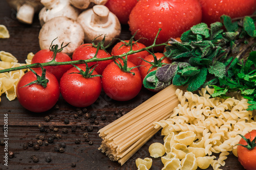 Fresh Italian food on wooden background.