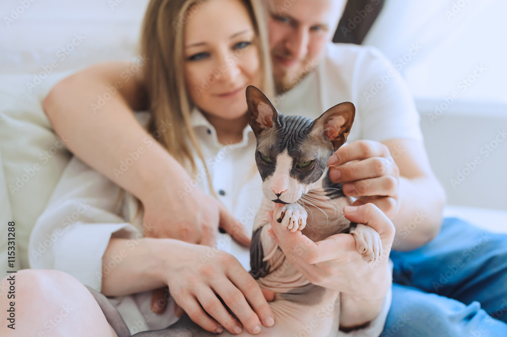 Loving man and woman with cat Loving man and woman with cat