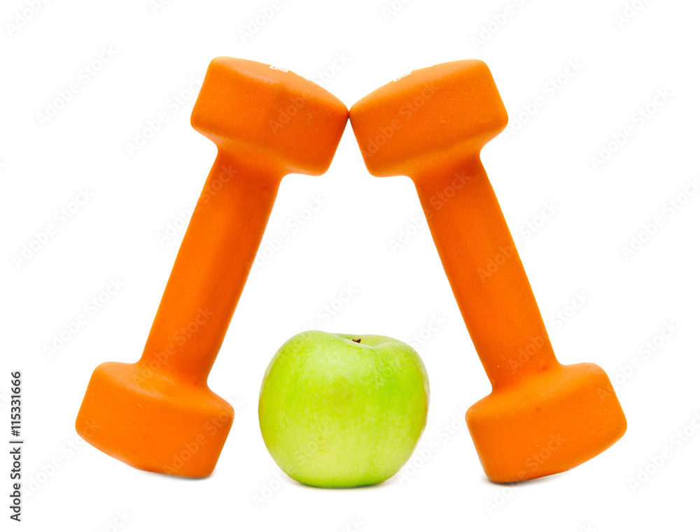 Dumbbells and a green apple Dumbbells and a green apple