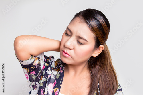 Wallpaper Mural Asian woman with shoulder pain Torontodigital.ca