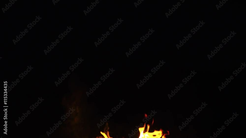 fire flames from campfire over black background fire flames from campfire over black background