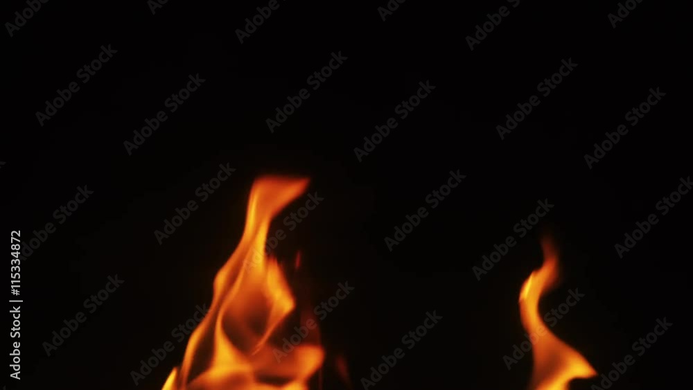 close up flames over blcak background in fireplace close up flames over blcak background in fireplace