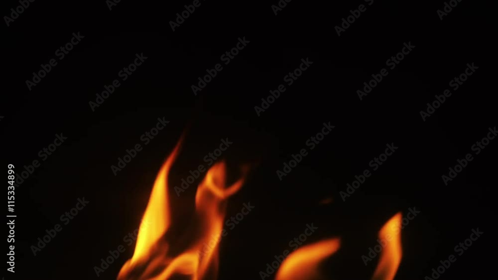 close up flames over blcak background in fireplace close up flames over blcak background in fireplace