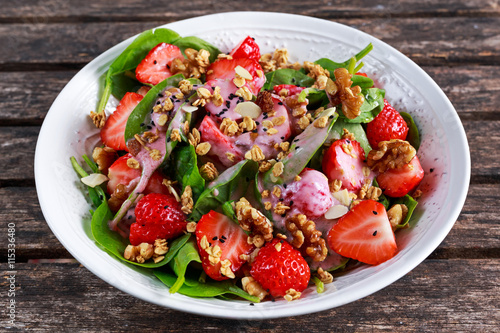 Summer Fruit Vegan Spinach Strawberry nuts Salad with yogurt. concepts health food