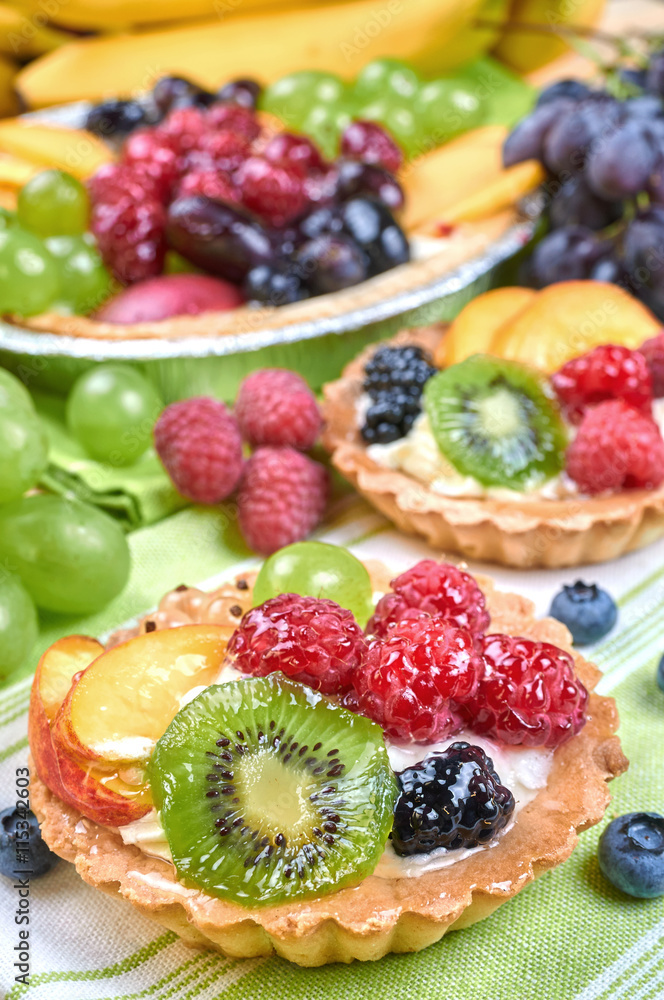 Mix of fruit tarts and fresh fruits Mix of fruit tarts and fresh fruits