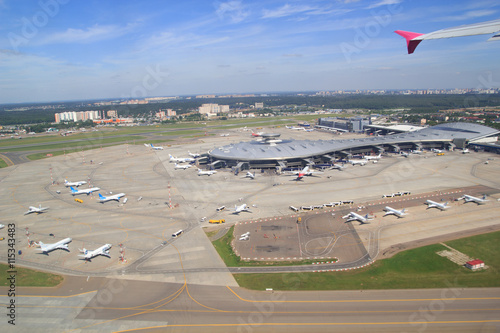 Airport building and airplanes from above photo