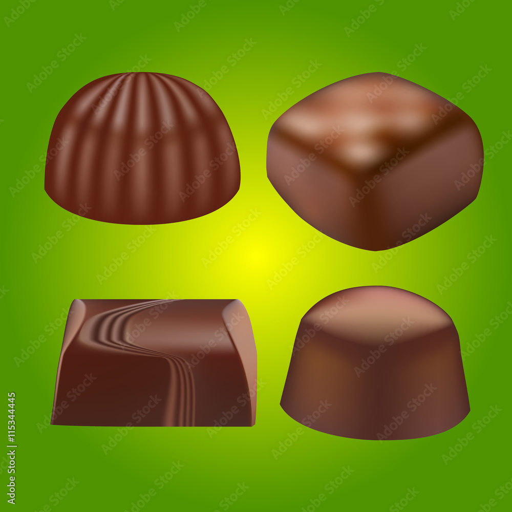 various chocolate pralines on green background various chocolate pralines on green background