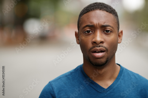 Young black man in city shocked face portrait © blvdone