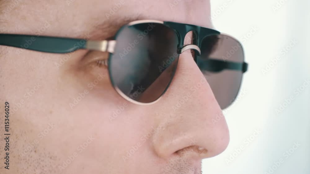 A man in sunglasses reflecting the clouds timelapse A man in sunglasses reflecting the clouds timelapse