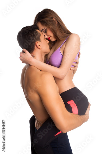 Shirtless model holding his girlfriend