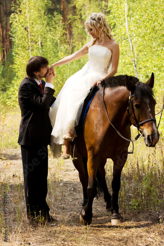 Bride and groom with horses