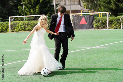 wedding couple playing football