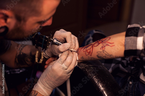Tattoo artist works in salon