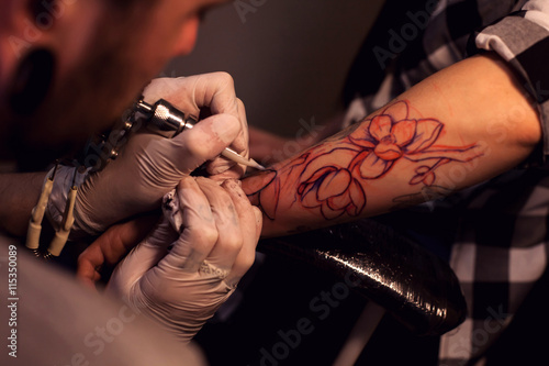 Tattoo artist works in salon
