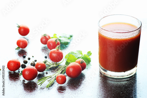 glass of tomato juice drops