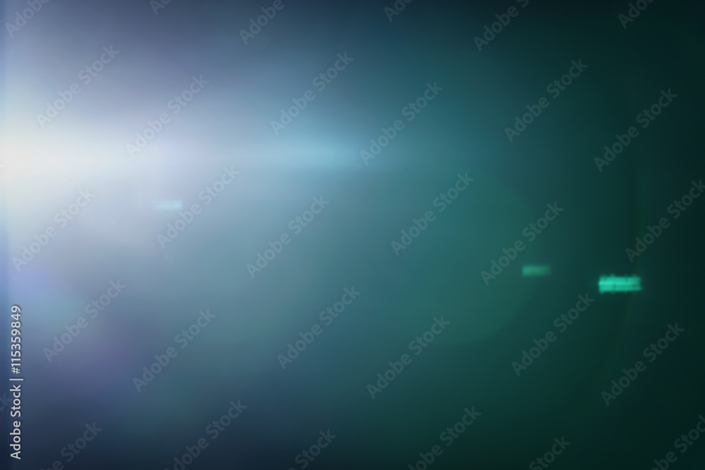 real green lens flare over dark background real green lens flare over dark background