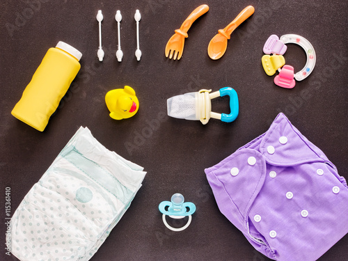 Flat lay of baby set with cloth diaper photo