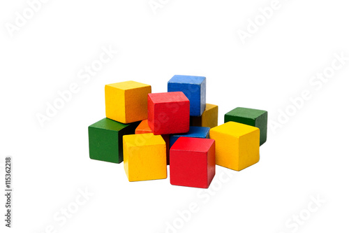 Wooden colorful building blocks isolated on white background. Cubes constructor. Vintage childrens toys. © sergio34