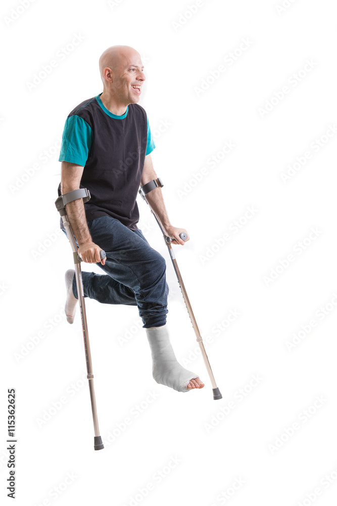 Young man with a broken ankle and a leg cast Young man with a broken ankle and a leg cast