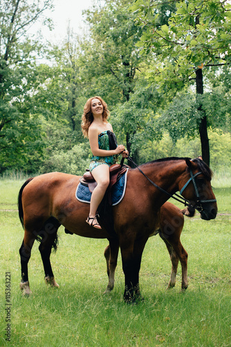 The girl on a horse in the park