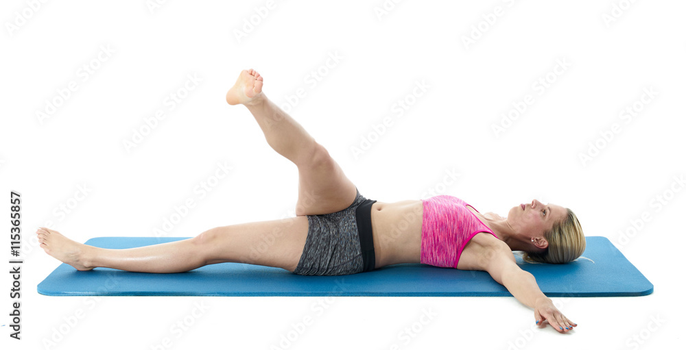Woman doing stretching exercises.. Woman doing stretching exercises..