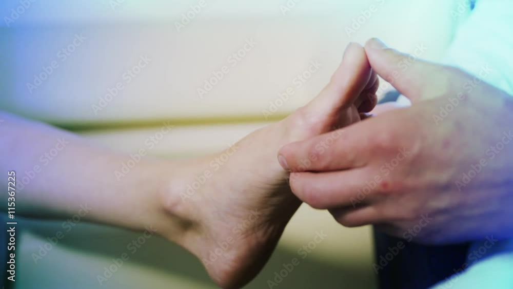 closeup doctor the traumatologist examines the patient the patient's foot, feet closeup doctor the traumatologist examines the patient the patient's foot, feet