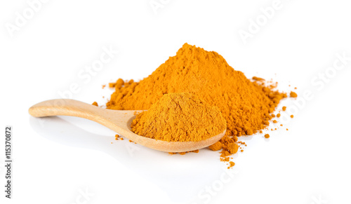 Turmeric powder on a wooden spoon isolated on white background