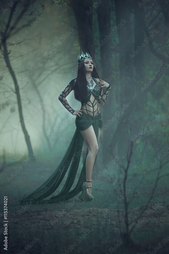 dark evil queen stands in the magic forest, wild Princess , vampire , hip toning , creative color,dark boho