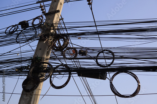The power cord is coiled neatly on poles