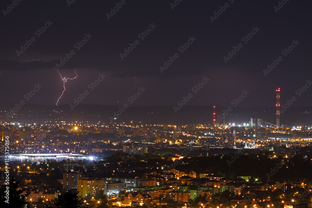 Fototapeta premium Lightning storm over city at night
