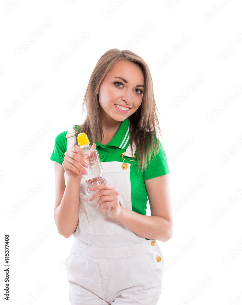 Beautiful brunette girl in fitness clothes with bottle of water isolated on white background. Sexy young woman posing in the studio. Beautiful brunette girl in fitness clothes with bottle of water isolated on white background. Sexy young woman posing in the studio.