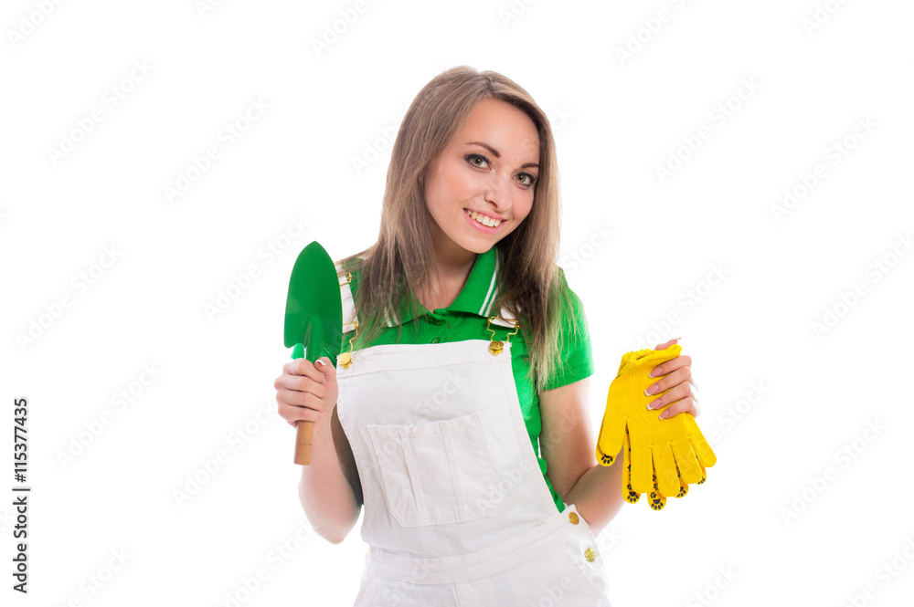 Beautiful young brunette girl in jeans shorts with tools isolated on white background. Beautiful young woman posing in the studio. Beautiful young brunette girl in jeans shorts with tools isolated on white background. Beautiful young woman posing in the studio.