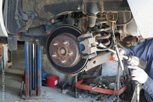 close up on wheel hub and disk brake, car repairing
