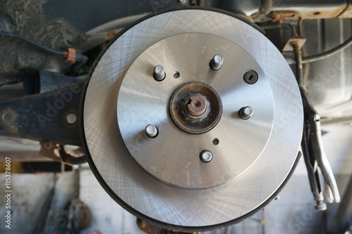 close up on wheel hub and disk brake, car repair