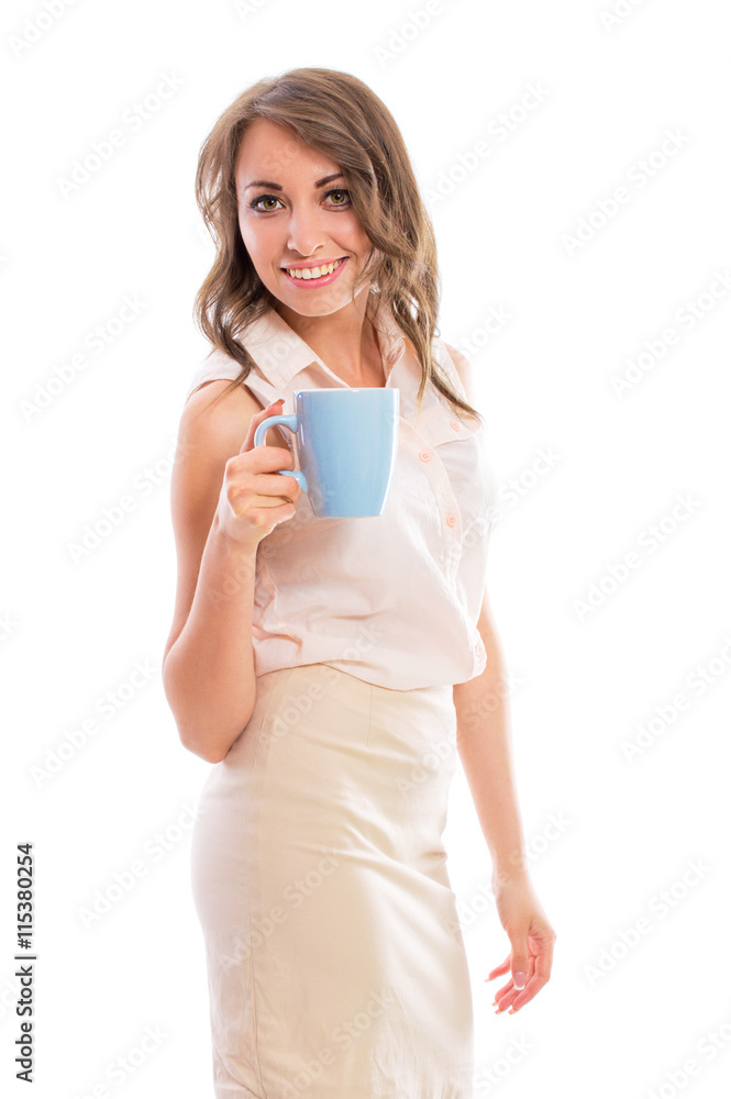 Young attractive brunette woman in a business suit drinking from blue cup, isolated on white background. Young attractive brunette woman in a business suit drinking from blue cup, isolated on white background.