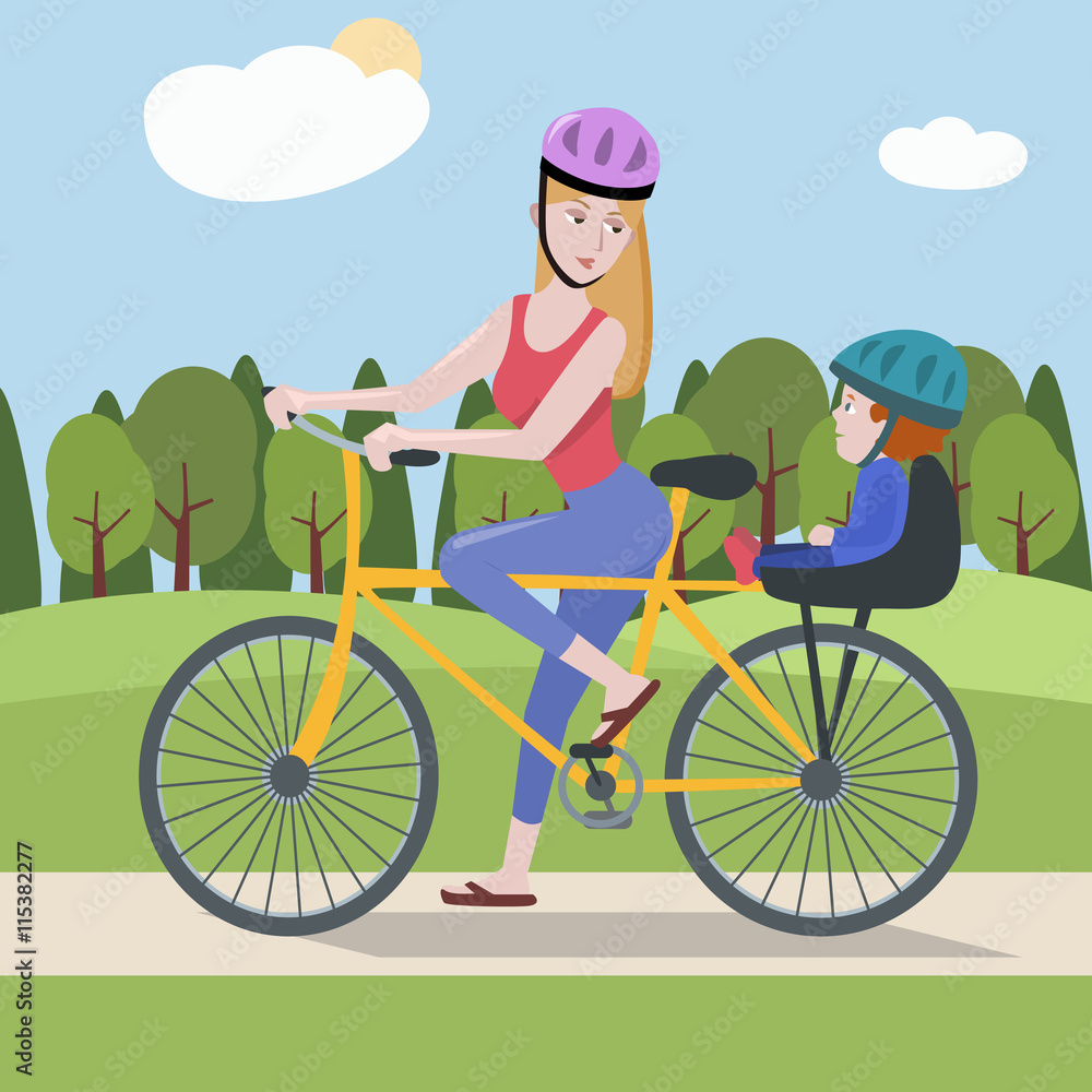 woman and toddler on a bike at the park woman and toddler on a bike at the park