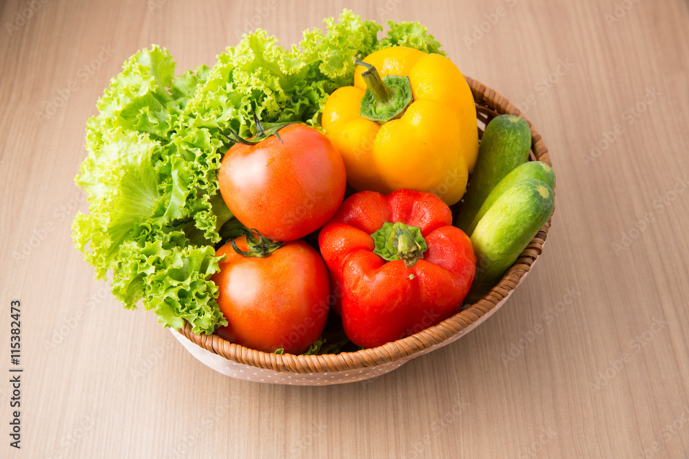 Fresh vegetable prepared in bowl on wooden table, Lettuce cucumb Fresh vegetable prepared in bowl on wooden table, Lettuce cucumb