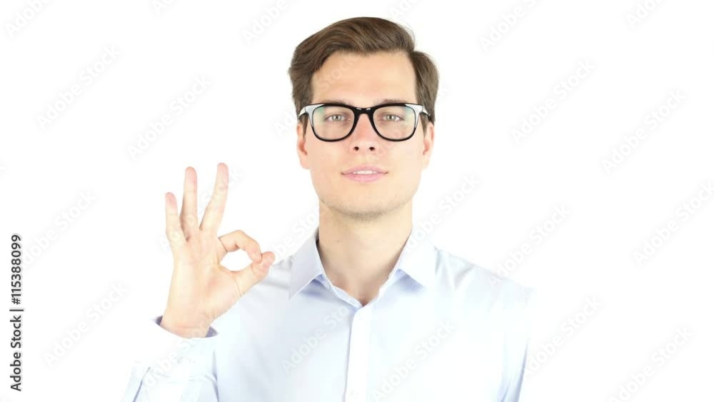 Young man shows sign and symbol ok on white background Young man shows sign and symbol ok on white background