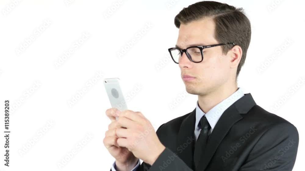 Professional business man messaging , sms or email on his smartphone Professional business man messaging , sms or email on his smartphone