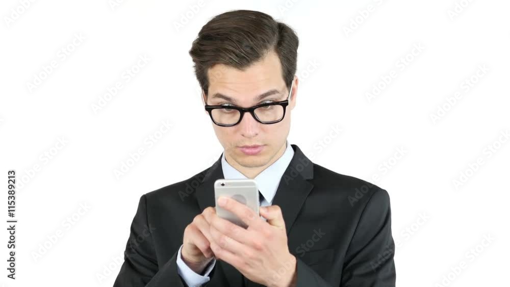 Happy bussinessman holding smartphone and celebrating his success , good news Happy bussinessman holding smartphone and celebrating his success , good news