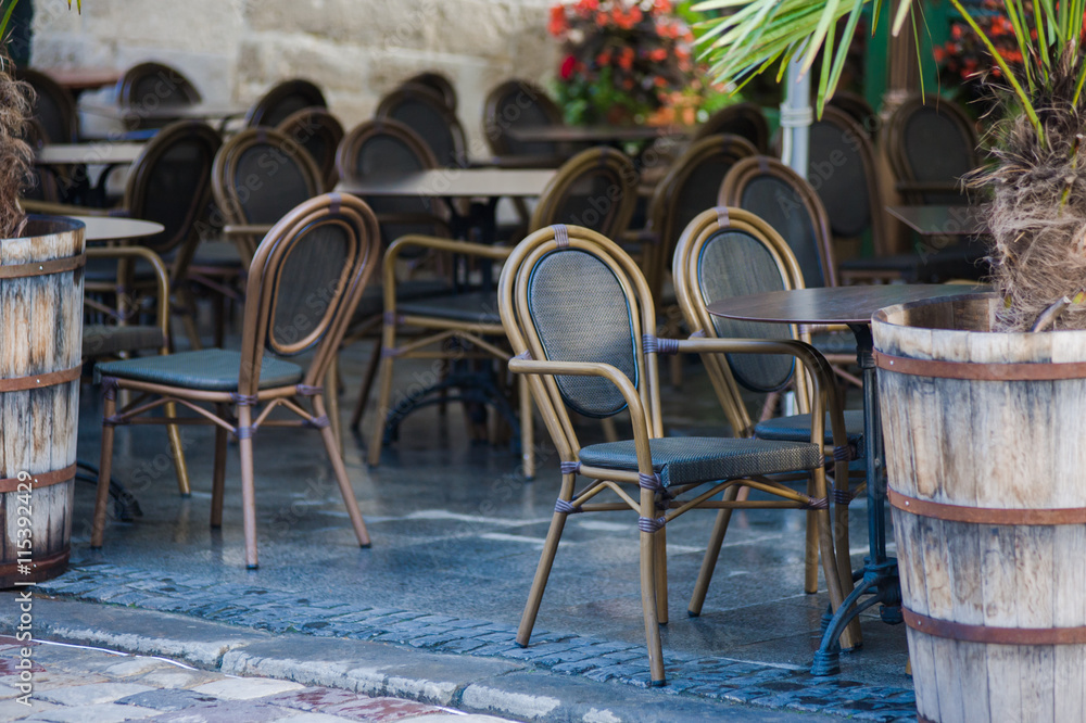 chairs on a cozy summer terrace. Italian cafe with coffee and sweets. exterior restaurant