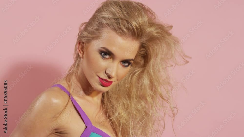 Beautiful young woman posing in bikini. Perfect slim body. Long healthy hair. Studio shot. Summer style photo of blonde beautiful slim woman in fashionable bikini. Beautiful young woman posing in bikini. Perfect slim body. Long healthy hair. Studio shot. Summer style photo of blonde beautiful slim woman in fashionable bikini.