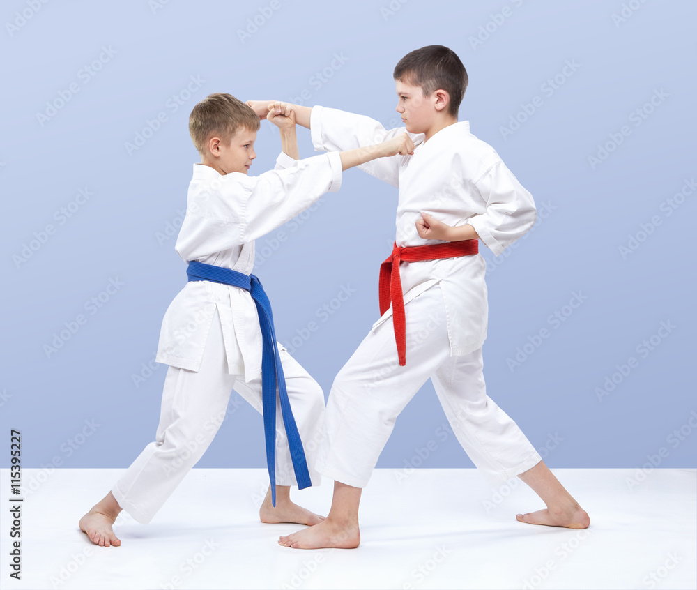 The boys are training strikes and blocks of hands The boys are training strikes and blocks of hands
